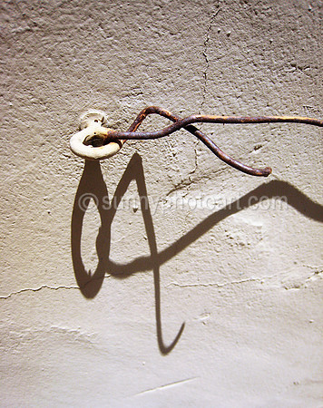 Wall, Hook, Wire and Shadow